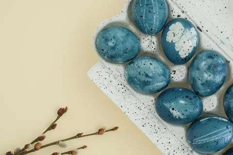 Stylish easter background with painted blue eggs and pussy willow branches on Stock Photos