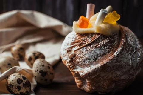 Stylish Easter cake with marshmallows and jelly bears on a dark rustic wooden Stock Photos