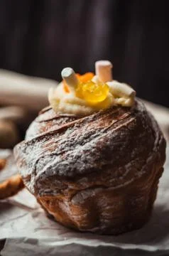 Stylish Easter cake with marshmallows and jelly bears on a dark rustic wooden Stock Photos