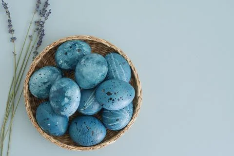 Stylish easter composition of easter eggs in blue shades and sprigs of lavender Fotos Stock