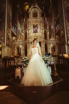 Stylish elegant bride on background the old church Stock Photos