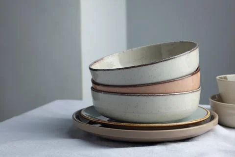 Stylish empty dishware on white table. Space for text Stock Photos