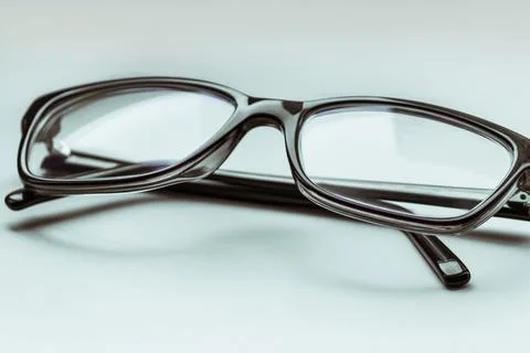 Stylish eyeglasses on the white background. Stock Photos