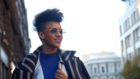 Stylish Fashion Blogger Walking Along Urban Street Stock Footage