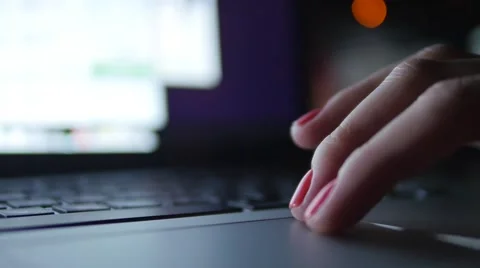 Stylish female hand on touchpad browsing internet site page. Out of focus dolly Stock Footage 56530759