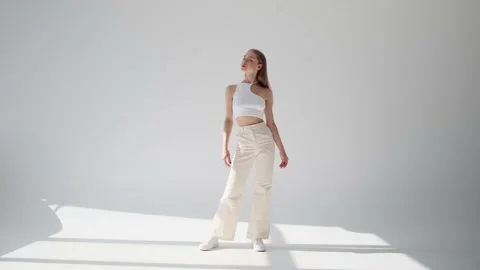 Stylish female model posing over white background Video stock 164535797