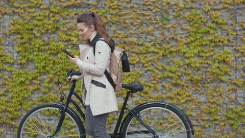 Stylish female using smartphone app outside on city street Stock Footage 195305240