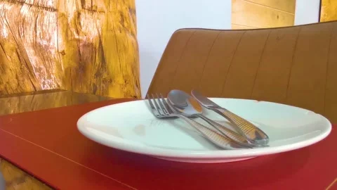 Stylish fine dining table setting with empty plate and cutlery. Stock Footage 332323959