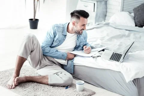 Stylish freelance worker completing task Stock Photos