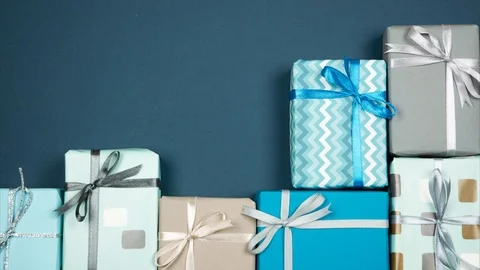 Stylish gift boxes in grey blue colours with copy space on the left. Stop motion Stock-Footage 120037398