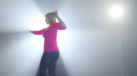 Stylish girl does a western dance in stage with bright full backdrop location Stock Footage 22842553