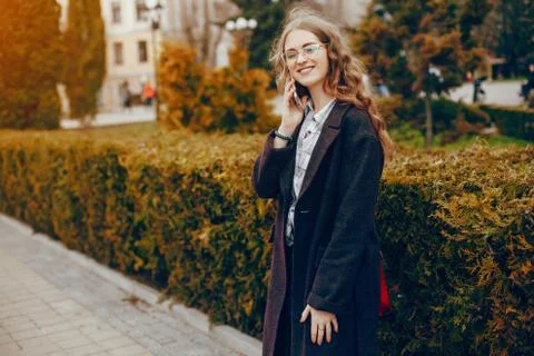 Stylish girl in a park Stock Photos