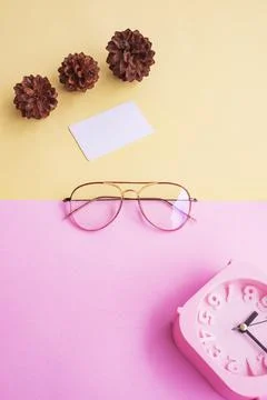 Stylish glasses over pastel background. Business Card, Pastel Pink And Yellow Stock Photos