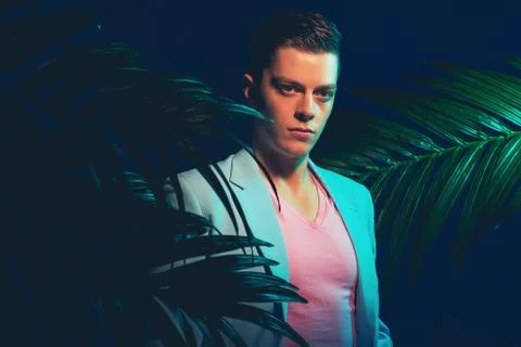 Stylish Gorgeous Young Man Between Palm Plants Stock Photos