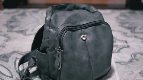 Stylish gray backpack on tiled floor Stock-Footage 312011834