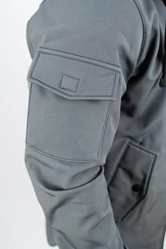 This stylish gray jacket features a distinctive arm patch detail, making it.. Stock Photos