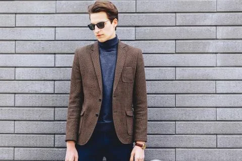 Stylish guy in jacket and sunglasses Stock Photos