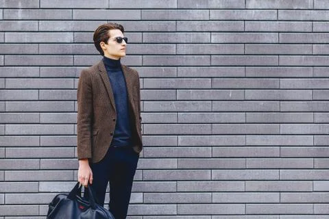 Stylish guy in jacket and sunglasses Stock Photos