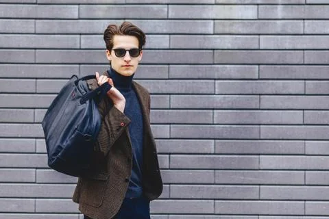 Stylish guy in jacket and sunglasses Stock Photos