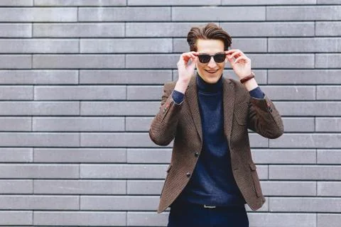 Stylish guy in jacket and sunglasses Stock Photos
