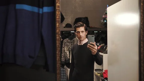 Stylish guy posing in a shop Stock Footage 88640611