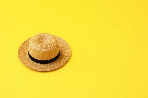 Stylish hat on yellow background, space for text. Summer beach accessories Stock Photos
