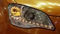 Stylish headlight of a yellow car HD Footage