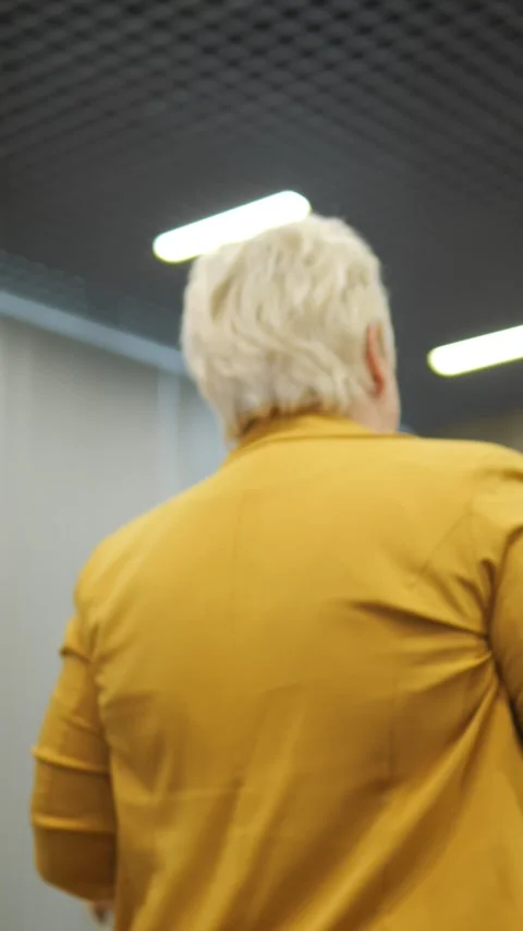 Stylish Individuals Dressed in Bright and Vibrant Yellow Outfits at a Social Stock Footage 284908823