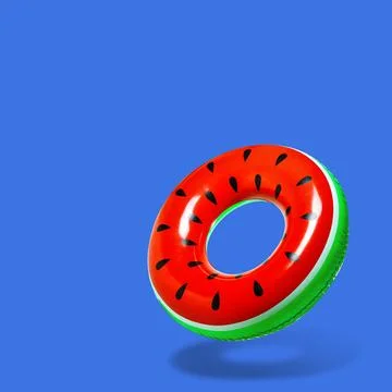 Stylish inflatable ring with watermelon pattern in air on blue background. .. Stock Photos