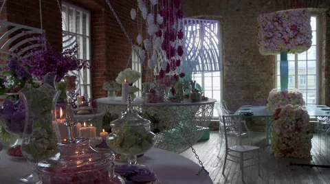Stylish interior of cafe decorated with flowers Video stock 44792678