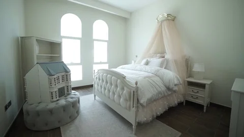 Stylish interior design bedrooms with brown patterned pillows on the bed and Video stock 76664048