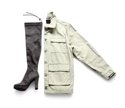 Stylish jacket with knee boot on white background Foto stock