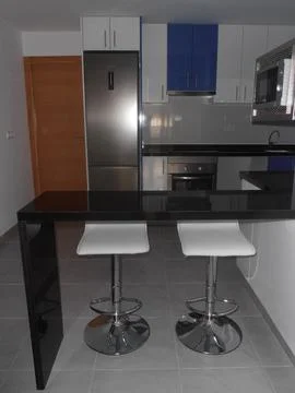 Stylish Kitchen Counter with Two Bar Stools Stock Photos