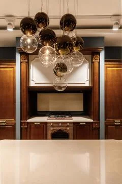 Stylish kitchen with elegant shiny table and chandelier 스톡 사진