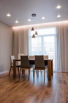 Stylish kitchen interior with dining table and chairs Photos