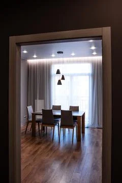 Stylish kitchen interior with dining table and chairs Fotos de archivo