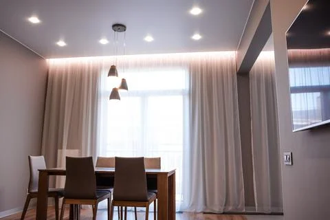 Stylish kitchen interior with dining table and chairs Fotos de archivo