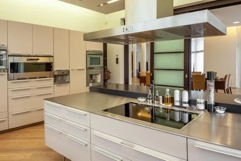 Stylish kitchen interior equipped with modern furniture and appliances Stock Photos