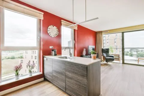 Stylish kitchen with red wall Stock Photos