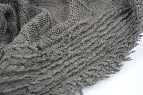 Stylish knitted from brown, woolen thread with an interesting pattern. Stock Photos