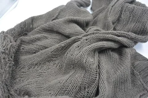 Stylish knitted from brown, woolen thread with an interesting pattern. Foto stock