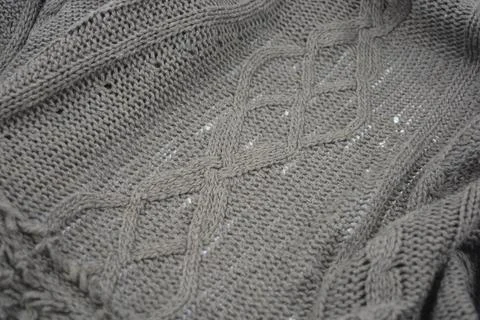 Stylish knitted from brown, woolen thread with an interesting pattern. 写真素材