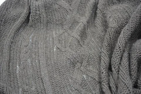 Stylish knitted from brown, woolen thread with an interesting pattern. 스톡 사진
