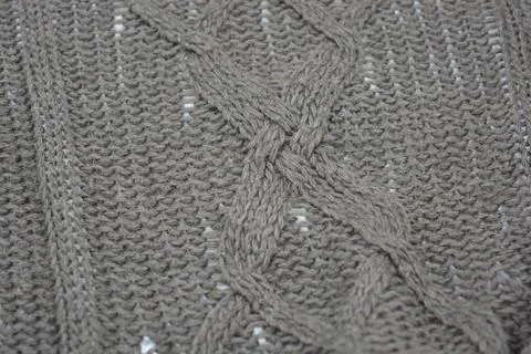 Stylish knitted from brown, woolen thread with an interesting pattern. 写真素材