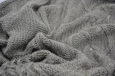 Stylish knitted from brown, woolen thread with an interesting pattern. 写真素材