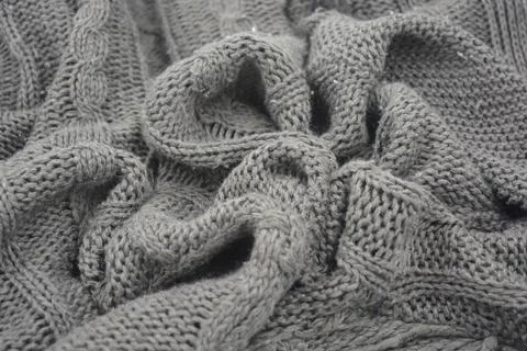 Stylish knitted from brown, woolen thread with an interesting pattern. Foto stock