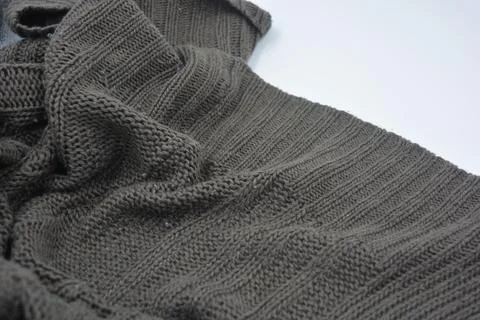 Stylish knitted from brown, woolen thread with an interesting pattern. Foto stock