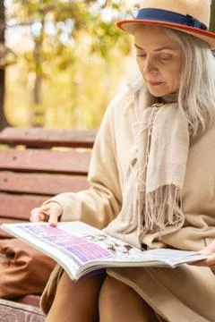 Stylish lady learning a foreign language outdoors Foto stock