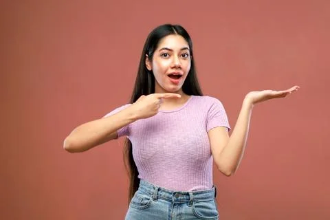 A Stylish Lady Is Posing While Smiling And Gesticulating With Her Hands  스톡 사진