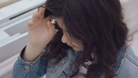 Stylish little model posing at camera in modern bay bar 4K Stock Footage 78760351